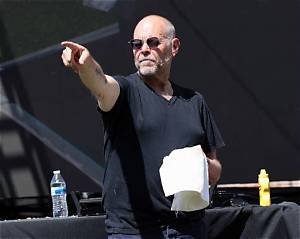 Alton Brown's Bacon Cooking Hack Prevents Setting off the Smoke Alarm