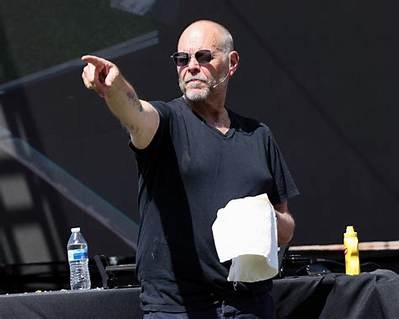 Alton Brown's Bacon Cooking Hack Prevents Setting off the Smoke Alarm