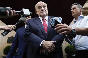 News Wrap: Giuliani Surrenders in Georgia on Charges of Conspiring to Overturn Election