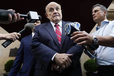 News Wrap: Giuliani Surrenders in Georgia on Charges of Conspiring to Overturn Election